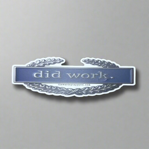 Sticker with 'did work' text on a combat infantry badge.